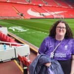 A photo of me (Emma) in Anfield, the home stadium for Liverpool football club.