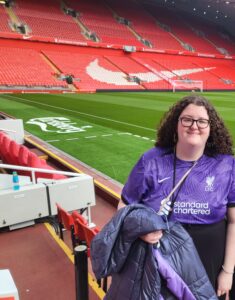 A photo of me (Emma) in Anfield, the home stadium for Liverpool football club.